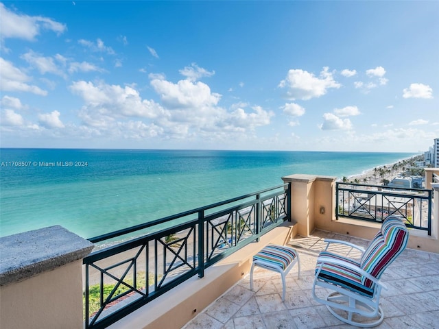 balcony featuring a water view