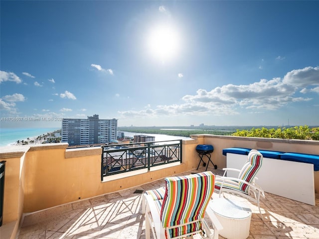 balcony featuring a water view