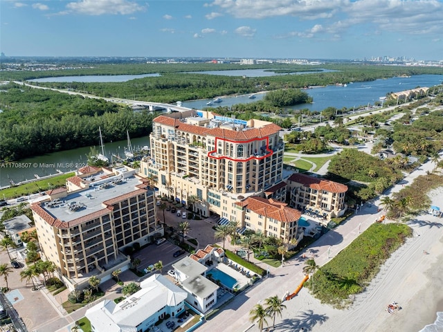 birds eye view of property featuring a water view