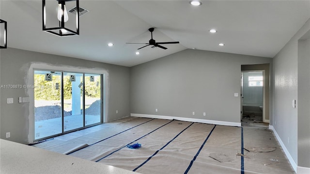 empty room featuring vaulted ceiling and ceiling fan