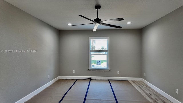 unfurnished room featuring ceiling fan and light hardwood / wood-style floors