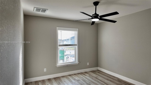 empty room featuring ceiling fan and light wood-type flooring