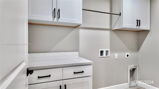 laundry area featuring cabinets, washer hookup, and hookup for an electric dryer