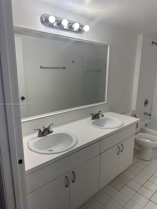 full bathroom with tile patterned floors, vanity,  shower combination, and toilet