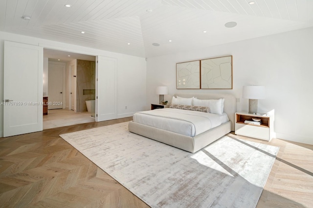 bedroom featuring light parquet flooring, vaulted ceiling, wooden ceiling, and connected bathroom