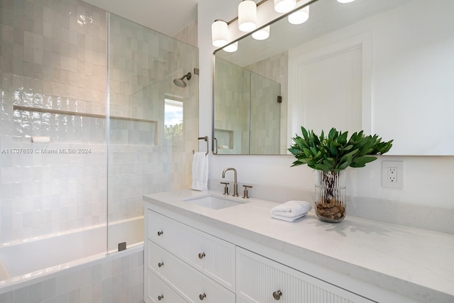 bathroom featuring vanity and tiled shower / bath combo