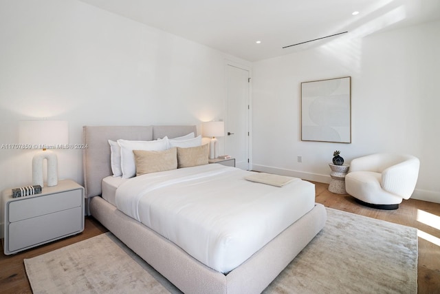 bedroom with wood-type flooring