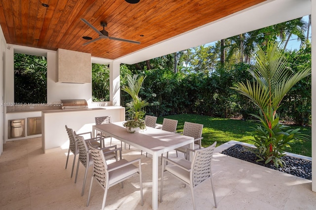 view of patio with ceiling fan and exterior kitchen