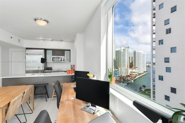 office space featuring plenty of natural light and sink