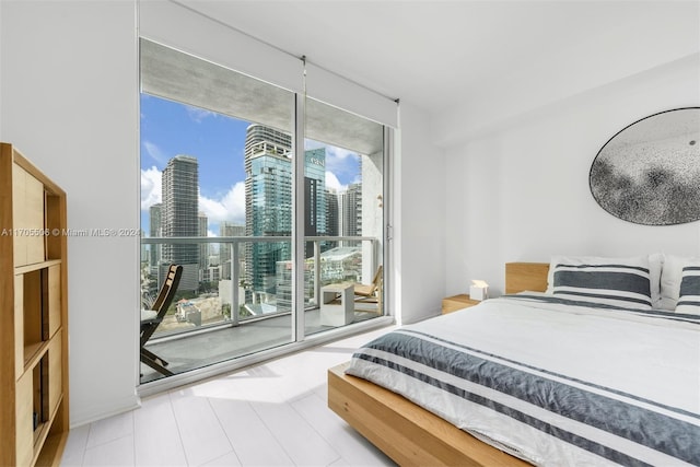 bedroom featuring access to exterior and multiple windows