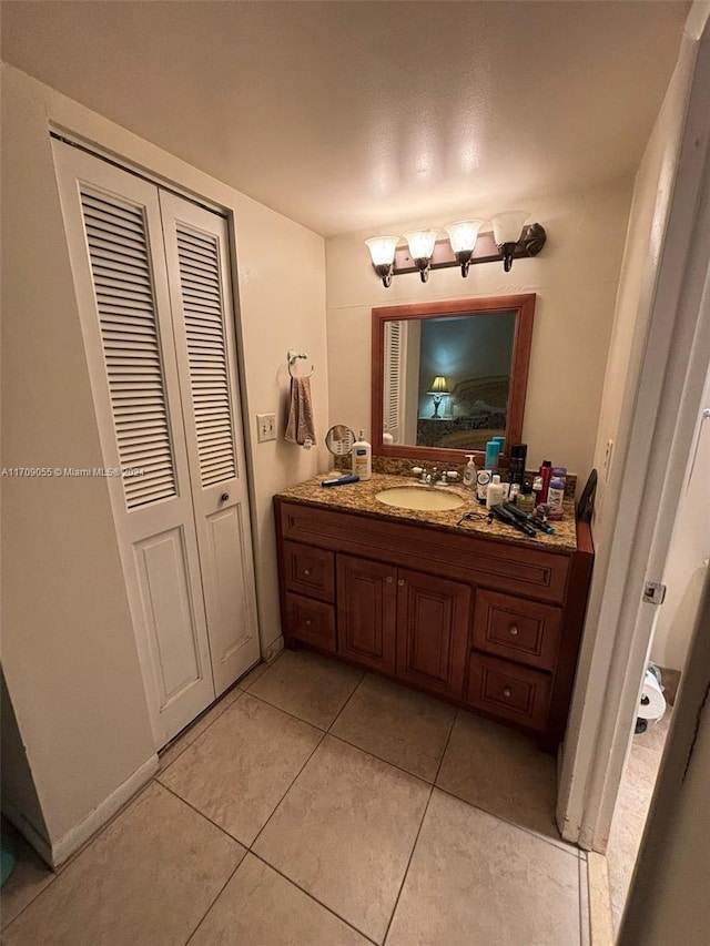 bathroom featuring tile patterned floors and vanity