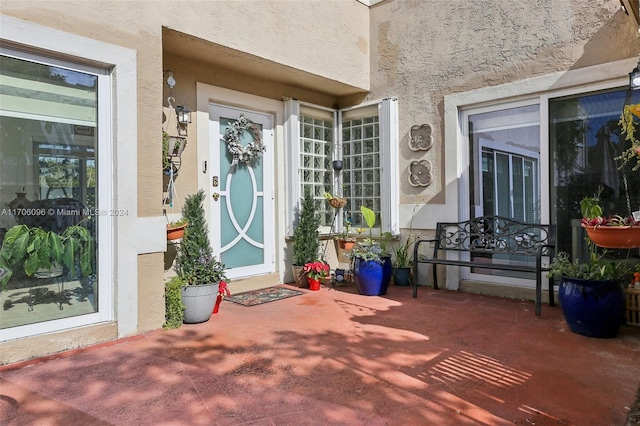 doorway to property featuring a patio area