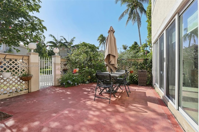 10949 Mainsail Dr, Cooper City, FL 33026 - view of patio / terrace featuring outdoor dining area and a gate