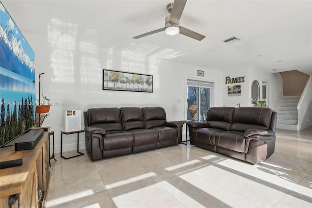 living room featuring ceiling fan and light tile patterned floors