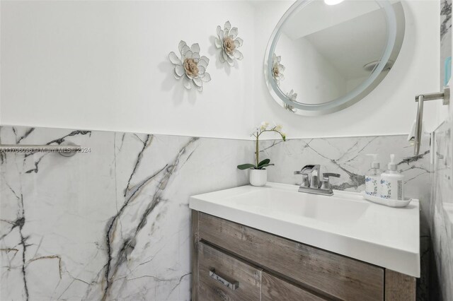 10949 Mainsail Dr, Cooper City, FL 33026 - bathroom with vanity, tile walls, and a wainscoted wall