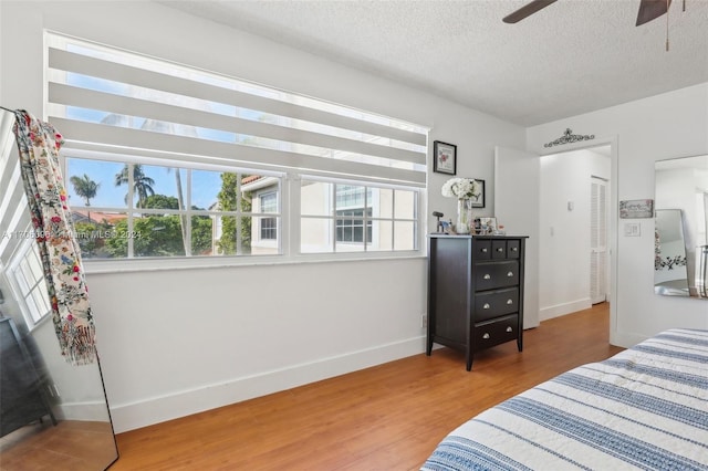 10949 Mainsail Dr, Cooper City, FL 33026 - bedroom featuring wood finished floors, a textured ceiling, and ceiling fan