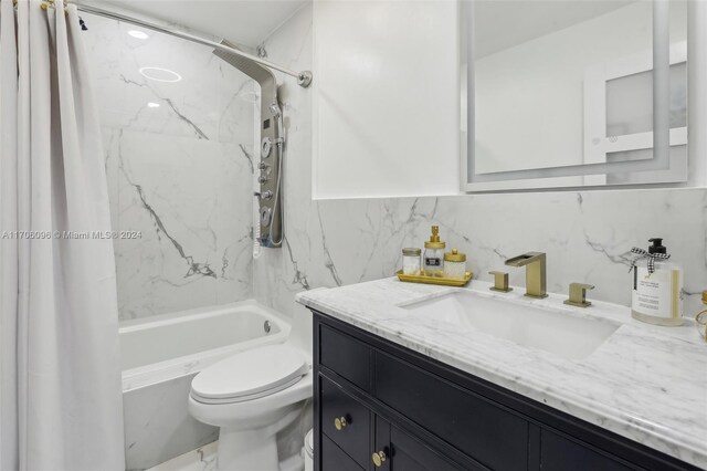 full bathroom featuring vanity, backsplash, toilet, tile walls, and shower / tub combo