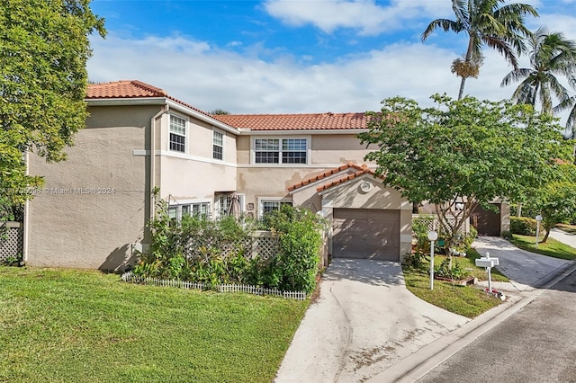 10949 Mainsail Dr, Cooper City, FL 33026 - view of front facade featuring stucco siding, driveway, a tiled roof, and a front yard