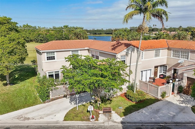 10949 Mainsail Dr, Cooper City, FL 33026 - view of property with concrete driveway and a water view