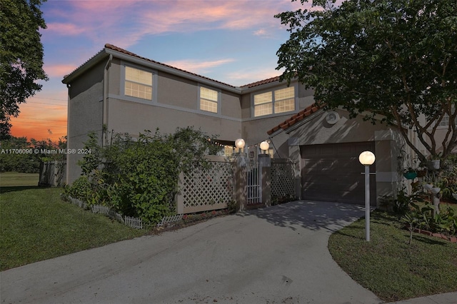 10949 Mainsail Dr, Cooper City, FL 33026 - mediterranean / spanish house featuring a tile roof, a garage, stucco siding, a yard, and driveway