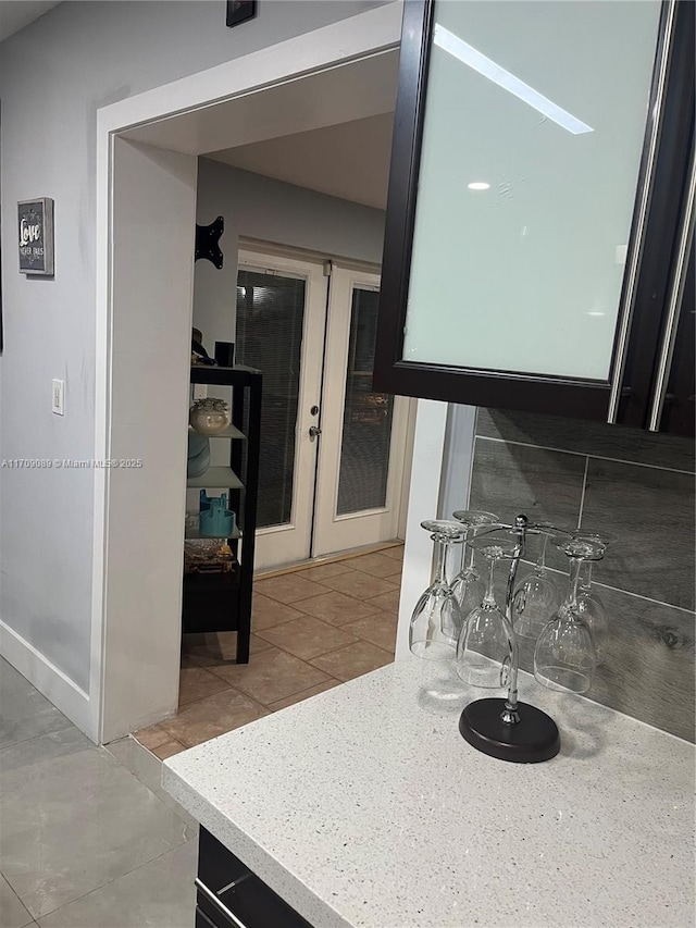 kitchen with french doors and light tile patterned floors