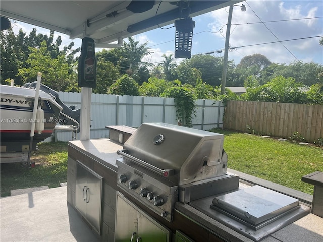 view of patio with area for grilling and grilling area