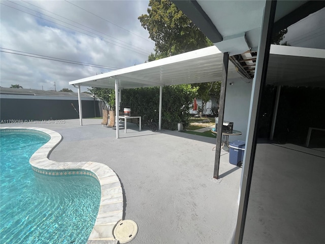 view of swimming pool with a patio area