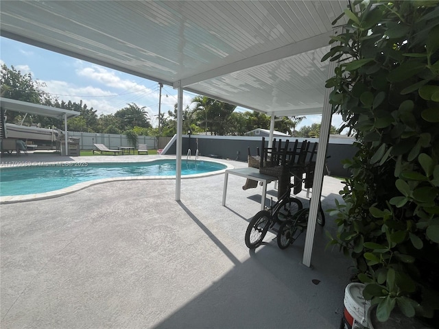 view of swimming pool featuring a patio