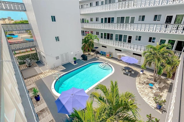 view of swimming pool featuring a patio area