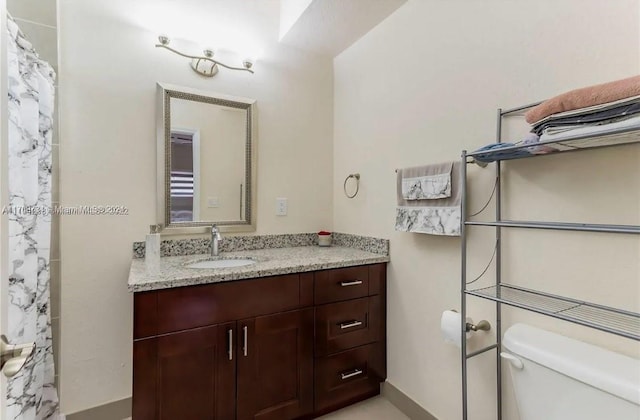 bathroom with vanity and toilet