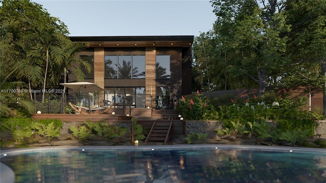 view of swimming pool with a wooden deck