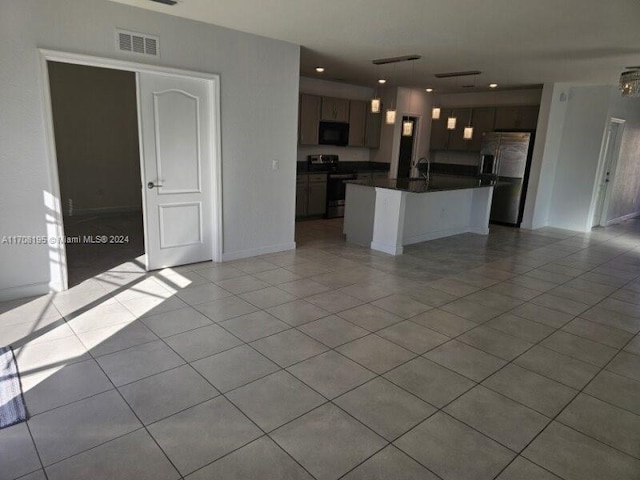 unfurnished living room featuring light tile patterned floors