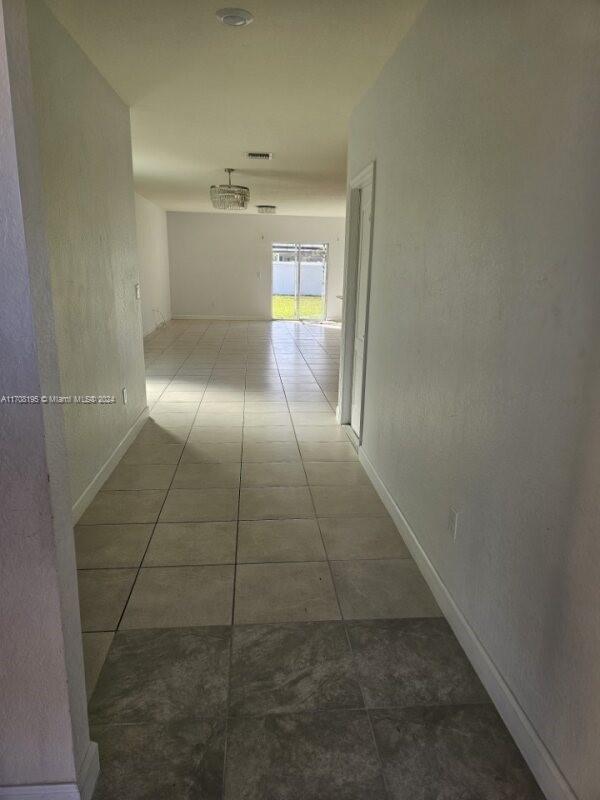 corridor with tile patterned floors