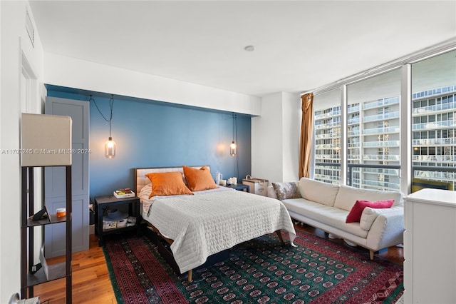 bedroom with hardwood / wood-style flooring