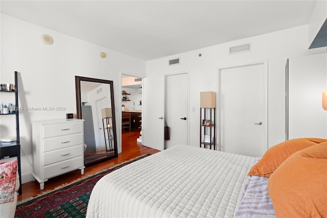 bedroom featuring dark hardwood / wood-style flooring