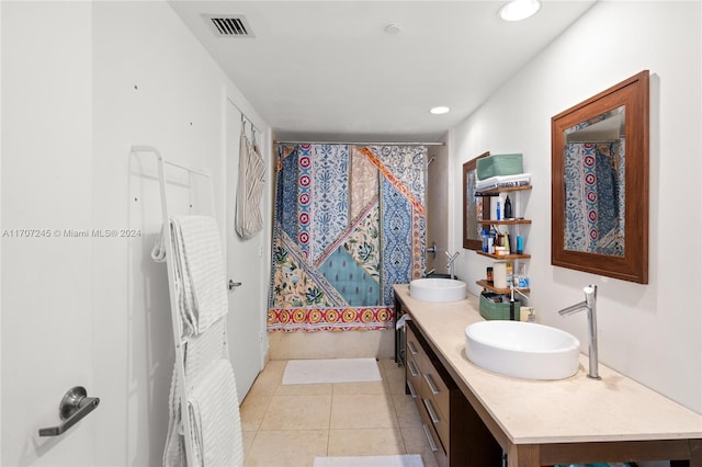 bathroom featuring tile patterned flooring and vanity