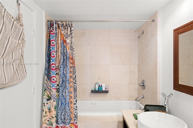 bathroom featuring vanity and shower / tub combo with curtain