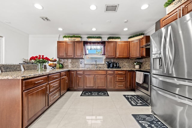 kitchen featuring light stone countertops, stainless steel appliances, tasteful backsplash, and crown molding