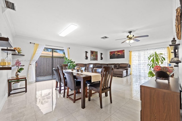 dining room featuring ceiling fan and ornamental molding