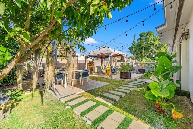 view of yard featuring a gazebo, a patio, and an outdoor hangout area