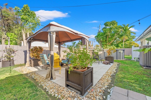 view of patio with a gazebo and central AC