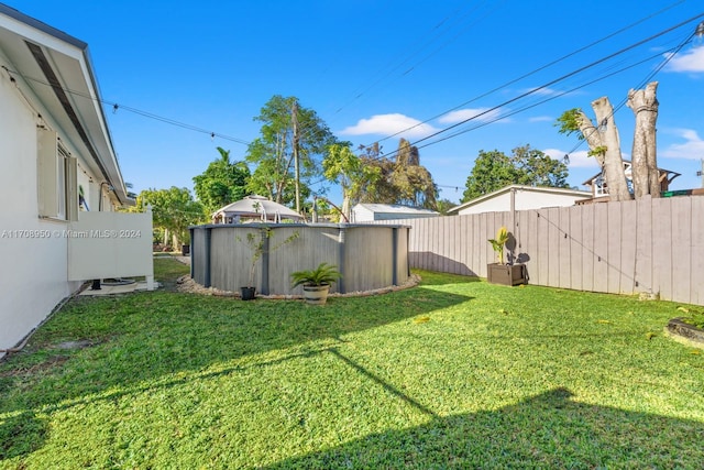 view of yard with a swimming pool