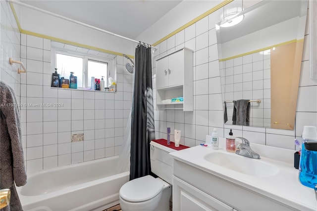 full bathroom with vanity, backsplash, toilet, shower / bathtub combination with curtain, and tile walls