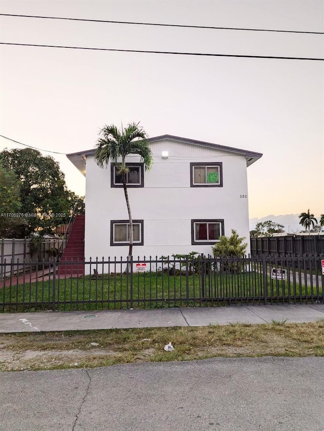 view of property exterior at dusk