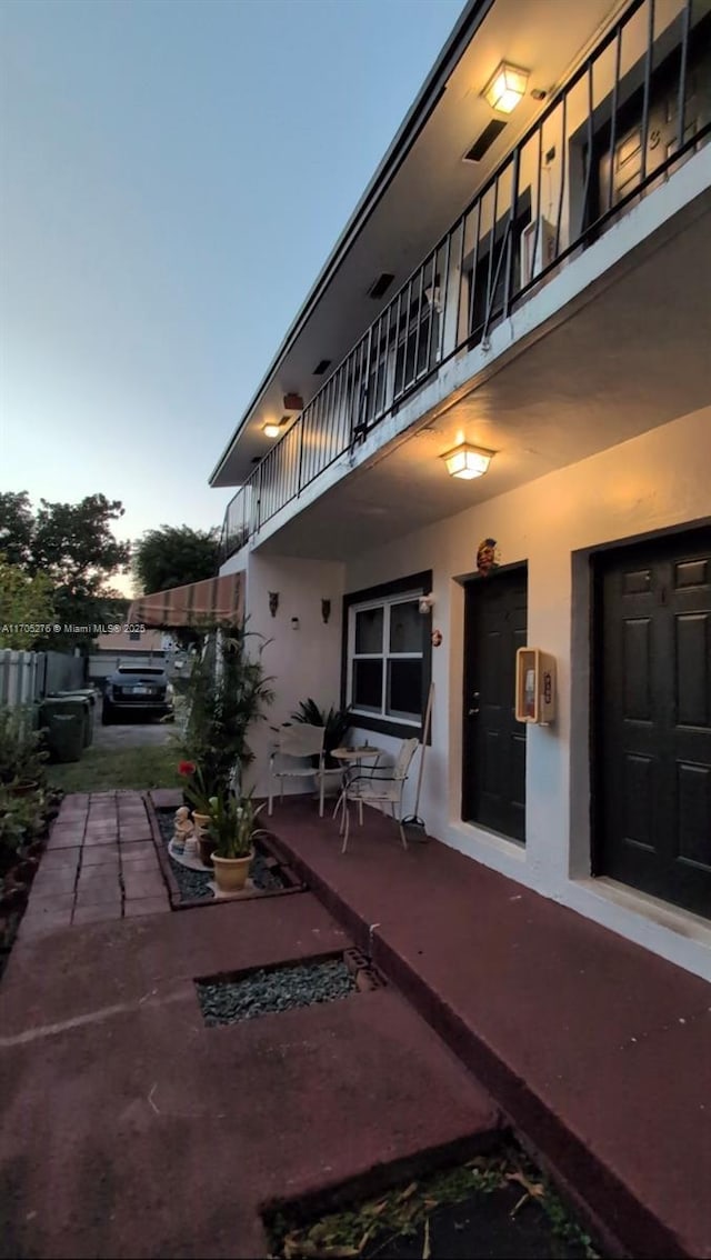 patio terrace at dusk with a balcony