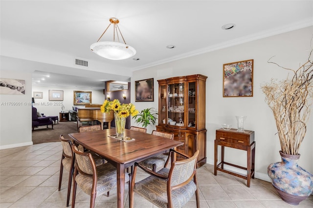 tiled dining space with ornamental molding