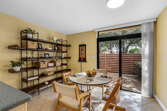 dining area featuring light tile patterned floors