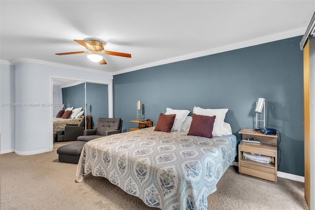 carpeted bedroom featuring ceiling fan, ornamental molding, and a closet