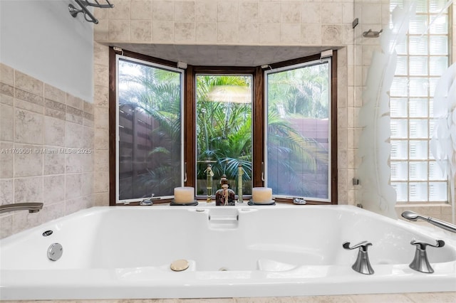 bathroom featuring tiled bath