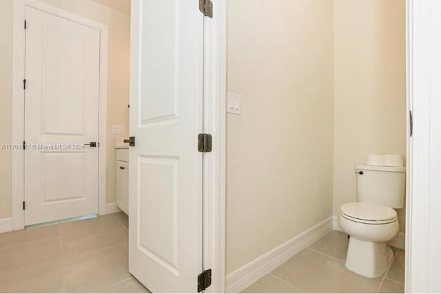 bathroom featuring tile patterned flooring and toilet